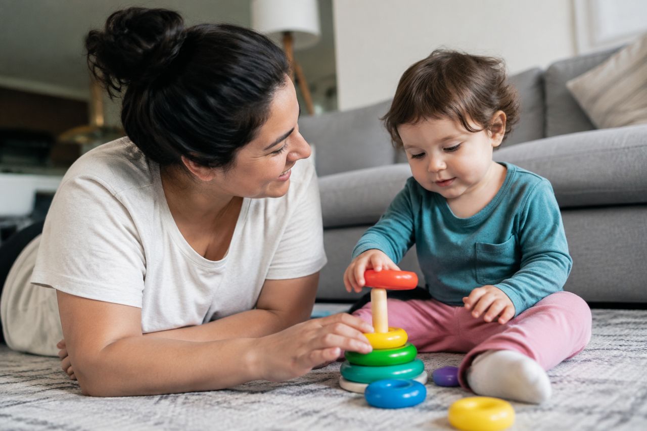 Nanny playing with a toddler