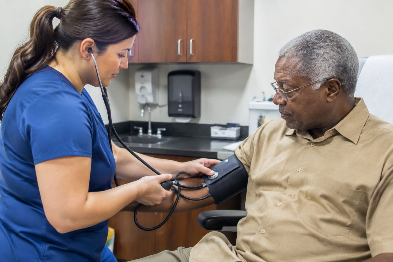Nurse taking blood pressure