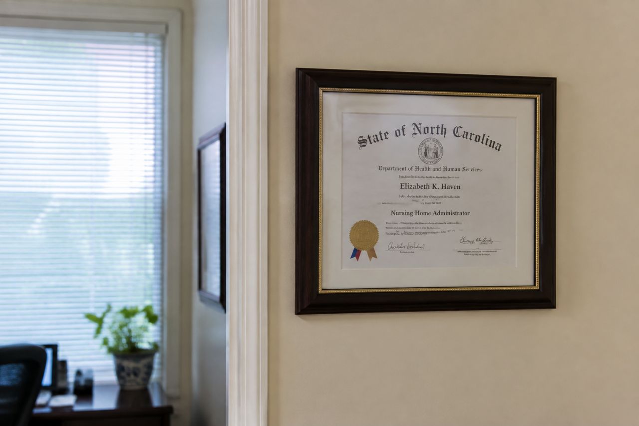 Certificate framed on an office wall