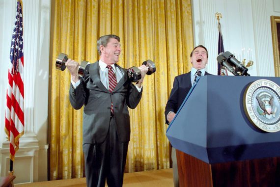 Photo of Ronald Reagan lifting weights at a podium in the White House in 1982.